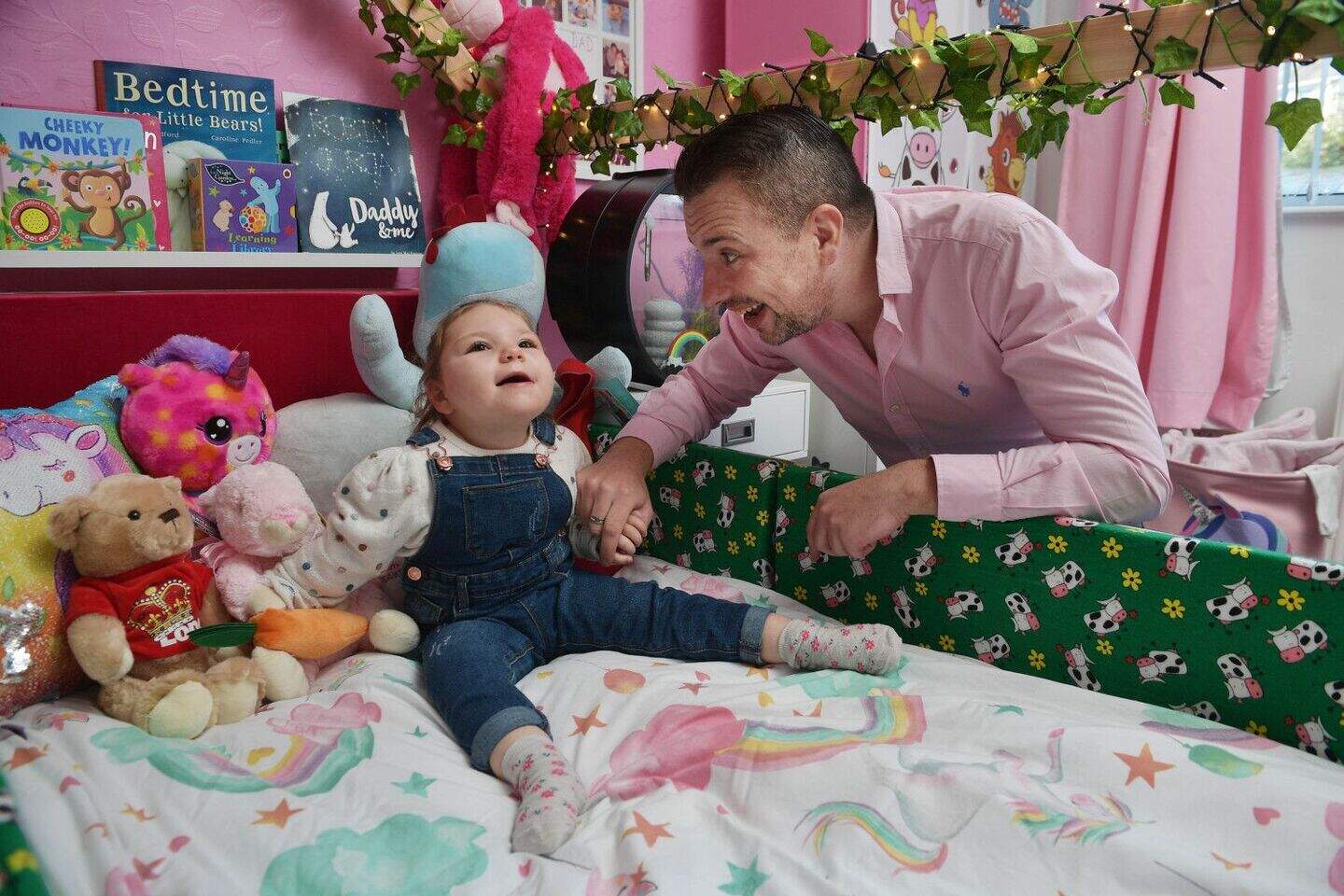 Robin Emerson with his daughter Jorja in her bedroom